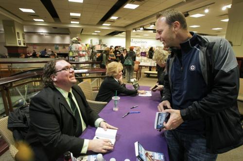 Mike McIntyre signs a copy of his latest book JOURNEY FOR JUSTICE How " Project Angel" Cracked The Candace Derksen Case, at the books launch at Chapters Polo Park. 111116 Mike Deal / Winnipeg Free Press