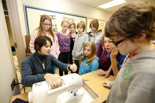 Windsor School students learn how to use a sewing machine in their first sewing shop class at Darwin School Tuesday. This is the first year that the students are given the independance of their own lockers, moving to different rooms between classes and taking the transit bus on their own to name a few. See 2017 project, Carolin Vesley and Doug Speirs Nov 10,2011 (Ruth Bonneville /  Winnipeg Free Press)