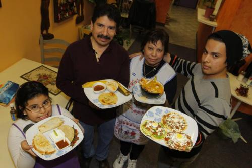 FOOD REVIEW - Cafe Mercadito Latino. Various dishes. L-R The Lemus family. Suzette, Julian, Sonia, Jesse. November 23, 2011 (BORIS MINKEVICH/ WINNIPEG FREE PRESS)