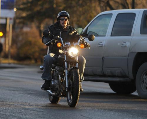 Gord Carpenter rides him motorcycle down south Osborne. Weather was unseasonaly warm in Winnipeg. November 24, 2011 (BORIS MINKEVICH/ WINNIPEG FREE PRESS)