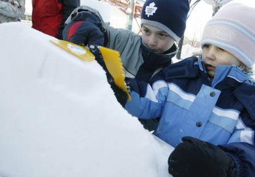 John Woods / Winnipeg Free Press / Dec 31, 2006 - 0611231  - Carson (5)(L) and Katie (4) Kowalchuk make ice sculptures as part of the festivities at the Forks on New Years Eve Sunday Dec 31/06.