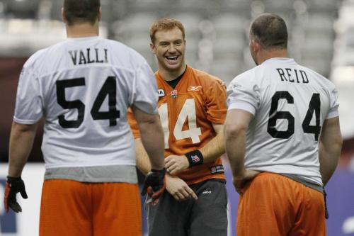 VANCOUVER, BC: NOVEMBER 26, 2011 -- BC Lions' Travis Lulay (14) jokes around with BC Lions' Dean Valli (54) and BC Lions' Angus Reid (64) during practice in Vancouver Saturday, November 26, 2011 ahead of the 2011 Grey Cup. (John Woods/Winnipeg Free Press)