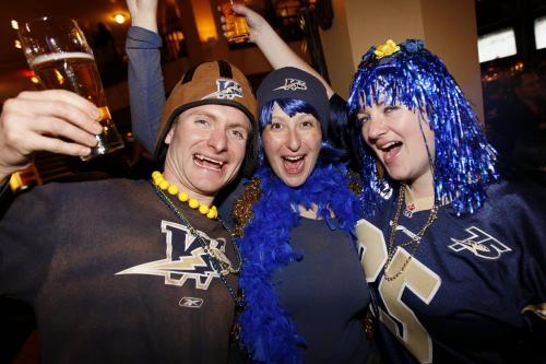 VANCOUVER, BC: NOVEMBER 27, 2011 --  Lisa Murphy-Quigley, Natalie Bargen and Adam Quigley (LtoR) were out taking part in Grey Cup festivities in Vancouver Saturday, November 26, 2011. (John Woods/Winnipeg Free Press)