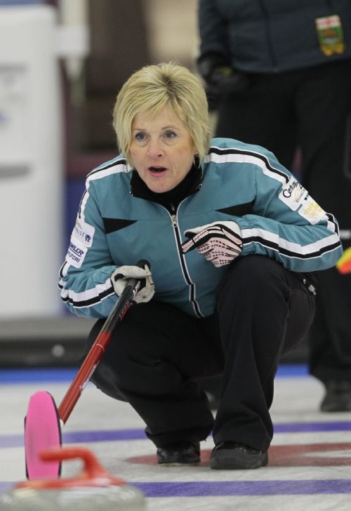 Brandon Sun 30112011 Lois Fowler guides in a rock during her rinks Curlettes League Final against Joyce McDougall's rink at the Brandon Curling Club on Wednesday. (Tim Smith/Brandon Sun)