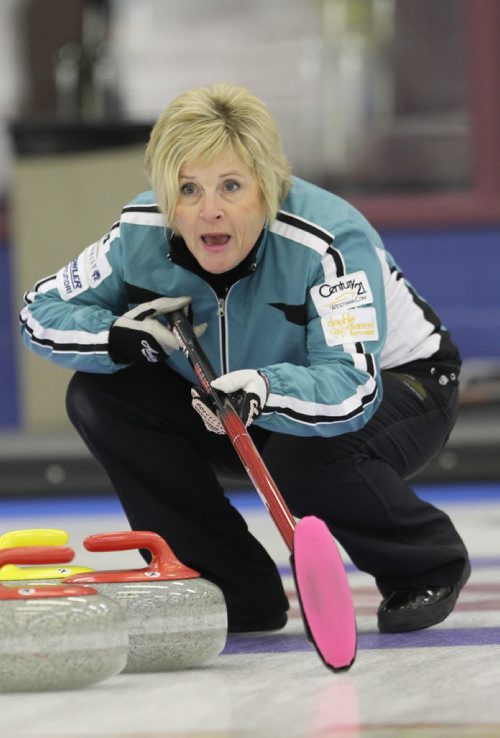 Brandon Sun 30112011 Lois Fowler guides in a rock during her rinks Curlettes League Final against Joyce McDougall's rink at the Brandon Curling Club on Wednesday. (Tim Smith/Brandon Sun)