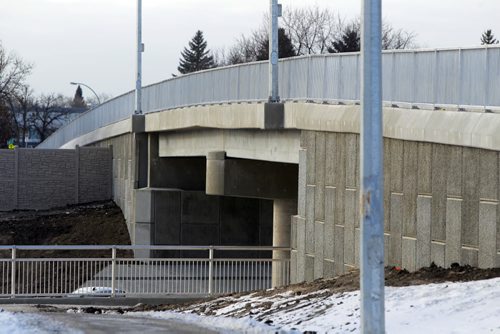 The extension of the Chief Peguis Bridge gets some final touches done to it by construction workers today. The road extends all the way to Lagimodiere Blvd. Rothesay Street Bridge. December 1, 2011(BORIS MINKEVICH / WINNIPEG FREE PRESS)