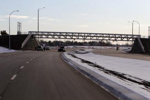 The extension of the Chief Peguis Bridge gets some final touches done to it by construction workers today. The road extends all the way to Lagimodiere Blvd. Gateway Road footbridge. December 1, 2011(BORIS MINKEVICH / WINNIPEG FREE PRESS)