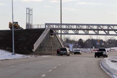 The extension of the Chief Peguis Bridge gets some final touches done to it by construction workers today. The road extends all the way to Lagimodiere Blvd. Gateway Road foot bridge. December 1, 2011(BORIS MINKEVICH / WINNIPEG FREE PRESS)