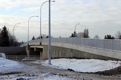 The extension of the Chief Peguis Bridge gets some final touches done to it by construction workers today. Rothesay Street Bridge.  The road extends all the way to Lagimodiere Blvd. December 1, 2011(BORIS MINKEVICH / WINNIPEG FREE PRESS)