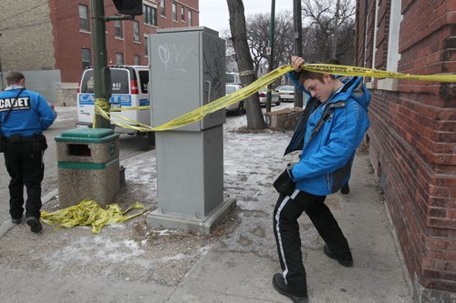 Police  are releasing no new information Sunday on why they are holding a crime scene at 270 Morley Ave in South OsborneNeighbors report seeing a body being removed Saturday from the block-Several police and cadets are on scene gauring the block- See Alex Paul story Dec 04, 2011   (JOE BRYKSA / WINNIPEG FREE PRESS)