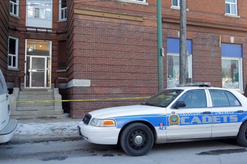 Police identification unit and many other police cars remain at the apartment at 270 Morley Ave. where a body was found over the weekend. December 5, 2011(BORIS MINKEVICH / WINNIPEG FREE PRESS)
