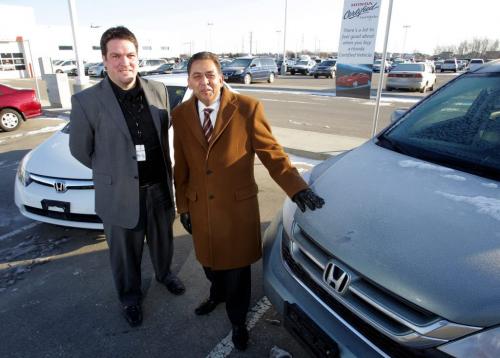 USED CAR STORY - Winnipeg Honda General Sales Manager Jim Mann-Baxter and CEO of The Dilawri Group Ashok Dilawri pose for a photo in the car lot with some used Honda vehicles. December 5, 2011(BORIS MINKEVICH / WINNIPEG FREE PRESS)