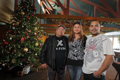 Little Saskatchewan evacuees at the Misty Lake Lodge north of Gimli, MB. Evacuees George Anderson (L) and Randy Anderson (R) flank Misty Lake Lodge manager Retha Dykes (centre) in the dining hall at the lodge. December 8, 2011(BORIS MINKEVICH / WINNIPEG FREE PRESS)
