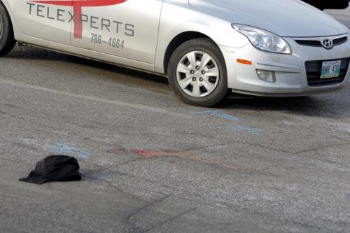 MVC at Portage Ave. and Maryland. Car vs man. A man died after being hit by an eastbound car.  December 11, 2011 BORIS MINKEVICH / WINNIPEG FREE PRESS