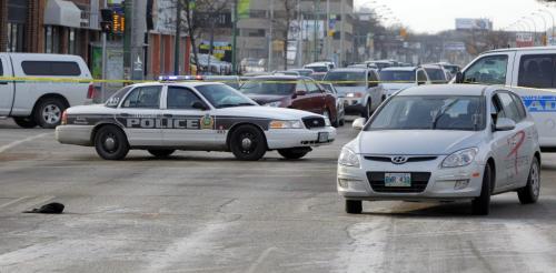 MVC at Portage Ave. and Maryland. Car vs man. A man died after being hit by an eastbound car.  December 11, 2011 BORIS MINKEVICH / WINNIPEG FREE PRESS