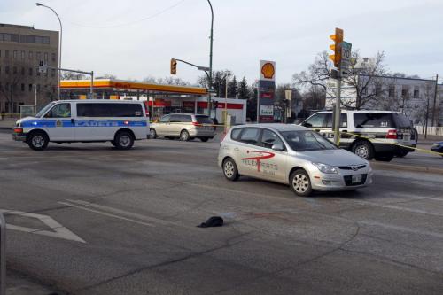 MVC at Portage Ave. and Maryland. Car vs man. A man died after being hit by an eastbound car.  December 11, 2011 BORIS MINKEVICH / WINNIPEG FREE PRESS