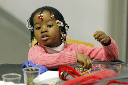 Four year old Esther Raji enjoys some crafts at the Kwanzaa party at the Caribbean Cultural Centre. December 11, 2011 BORIS MINKEVICH / WINNIPEG FREE PRESS