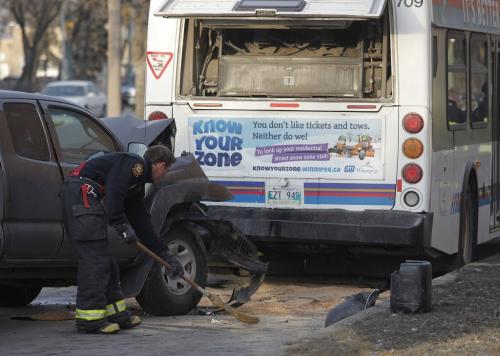December 11, 2011 - 121211  -  Fire and police attend to a truck and bus collision on northbound Main at Armstrong Sunday, December 11, 2011.    John Woods / Winnipeg Free Press