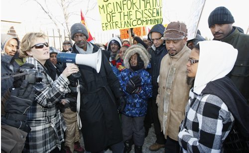 A large group of Eritrean demonstrators marched outside of the Winnipeg Free Press Thursday afternoon protesting a story that appeared in the paper . Managing Editor Margo Goodhand  met with the group outside the Free Press  and listened to their compliant . The peaceful protest was interrupted  for a brief  time a  small group in a car that antagonized the demonstrators . Police quickly moved in a with organizers to break up the disruption .The group left ended the demo a short time later and  left the  Wpg Free Press without incident . - KEN GIGLIOTTI /  WINNIPEG FREE PRESS /  Dec. 15 2011