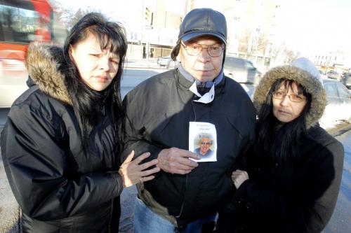At the corner of Sherbrook and Portage Ave. where Eddy Bone where he got hit by a car. In photo: daughter Debbie Meekis, brother Victor Bone, and daughter Barbara Bone. December 15, 2011 BORIS MINKEVICH / WINNIPEG FREE PRESS