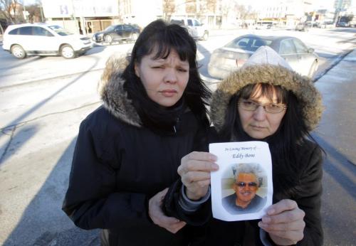 At the corner of Sherbrook and Portage Ave. where Eddy Bone where he got hit by a car. In photo: daughter Debbie Meekis and daughter Barbara Bone. December 15, 2011 BORIS MINKEVICH / WINNIPEG FREE PRESS
