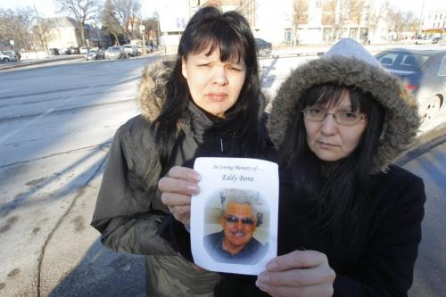 At the corner of Sherbrook and Portage Ave. where Eddy Bone where he got hit by a car. In photo: daughter Debbie Meekis and daughter Barbara Bone. December 15, 2011 BORIS MINKEVICH / WINNIPEG FREE PRESS