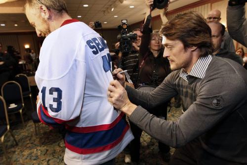 December 17, 2011 - 111217  - Teemu Selanne signs a jersey for Ryan Cheale at a press conference at the Fairmont Hotel in Winnipeg Saturday, December 17, 2011. Selanne returns to Winnipeg today after playing his last game in Winnipeg on Feb. 4, 1996. John Woods / Winnipeg Free Press