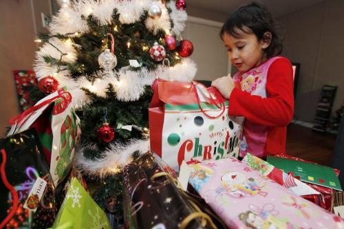 December 19, 2011 - 111219  - Kenisty McKay, 5, finds a Christmas present in her temporary home at Misty Lake Lodge, just north of Gimli, Monday, December 19, 2011. McKay's family is one of many evacuated from Lake St. Martin due to flooding. John Woods / Winnipeg Free Press