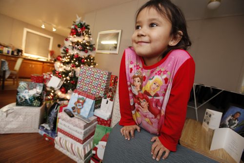 December 19, 2011 - 111219  - Kenisty McKay, 5, is photographed with her family Christmas presents in her temporary home at Misty Lake Lodge, just north of Gimli, Monday, December 19, 2011. McKay's family is one of many evacuated from Lake St. Martin due to flooding. John Woods / Winnipeg Free Press