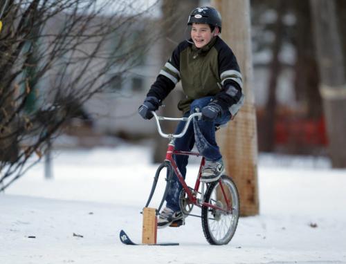 Mitchell Ketler,14, made a ski bike with a studded tire. He was ripping it up on River Road in St. Vital.  December 22, 2011 BORIS MINKEVICH / WINNIPEG FREE PRESS
