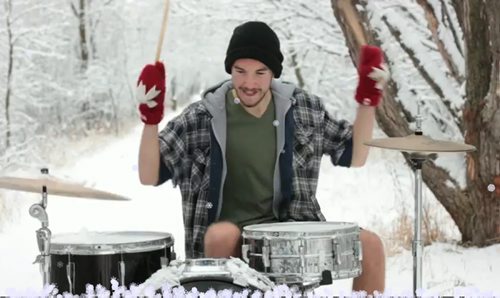 Screen grab shot of Drummer Sean Quigley from his Little Drummer Boy video where he is wearing Red Canada mitts. For story on the red mitts for charity.  Winnipeg Free Press