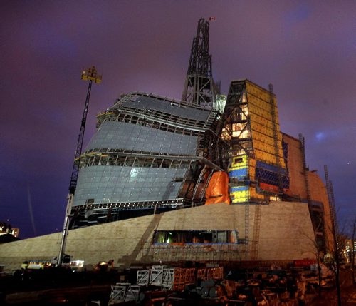 The construction site for the Canadian Museum for Human RIghts glows at dusk up the road from the the 1st Annual Public meeting . See Carol Sander's tale. December 6, 2011 - (Phil Hossack / Winnipeg Free Press)  CMHR