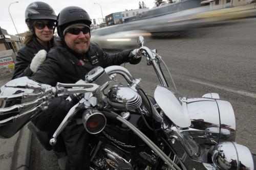 December 26, 2011 - 111226  -  Dwayne Newman and his daughter Carly, who is home visiting from England, were out riding his Harley on Portage Avenue Monday, December 26, 2011.    Winnipeggers enjoyed above zero temperatures today. John Woods / Winnipeg Free Press