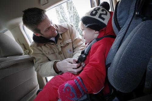 December 30, 2011 - 111230  -  Tom Wallace buckles his son Soren into his car seat in Winnipeg Friday, December 30, 2011.  The federal government has introduced new car seat regulations starting January 1.  John Woods / Winnipeg Free Press