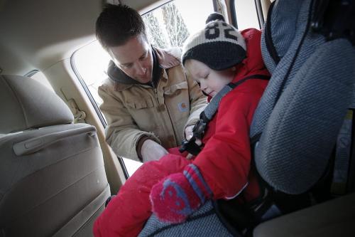 December 30, 2011 - 111230  -  Tom Wallace buckles his son Soren into his car seat in Winnipeg Friday, December 30, 2011.  The federal government has introduced new car seat regulations starting January 1.  John Woods / Winnipeg Free Press