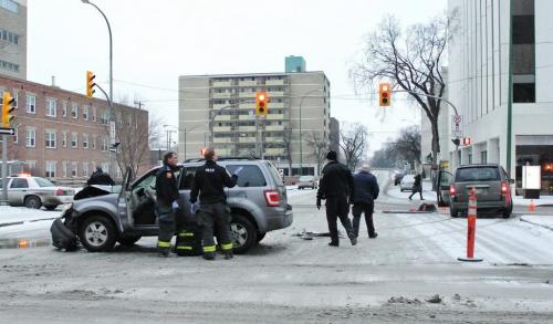 A person was transported in unknown condition from the scene of a two vehicle collision at Broadway and Donald shortly after 8:30 this morning. Donald is blocked to all traffic at this time.  111231 Mike Deal / Winnipeg Free Press