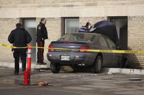 January 1, 2012 - 120101  - Police investigate a collision where a car drove into the St Boniface Hospital Education Building at 431 Tache Sunday, January 1, 2012.  John Woods / Winnipeg Free Press