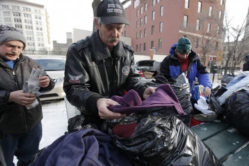 January 1, 2012 - 120101  - Ron Eldridge (C) of Devoted To You Street Ministries distribute clothing to disadvantaged people in Market Square  Sunday, January 1, 2012.  John Woods / Winnipeg Free Press