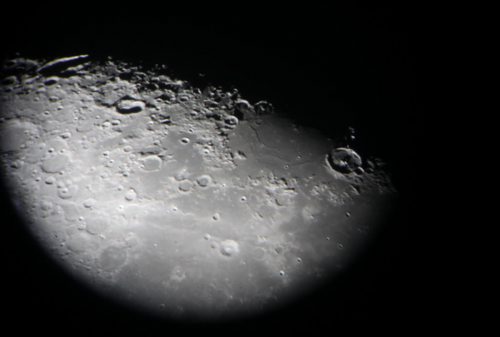 Brandon Sun Craters on the surface of the moon are visible through the eye-piece of the 16 inch telescope at the Brandon University observatory on Wednesday evening.  (Bruce Bumstead/Brandon Sun)