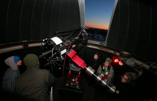 Brandon Sun Brandon University physic students, long with friends and family members, spent the early evening viewing Venus, Jupiter and the moon during at the BU observatory on the roof of McMaster Hall on Wednesday. (Bruce Bumstead/Brandon Sun)