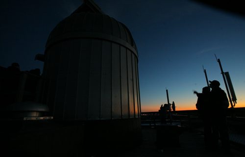 Brandon Sun Brandon University physic students, long with friends and family members, spent the early evening viewing Venus, Jupiter and the moon during at the BU observatory on the roof of McMaster Hall on Wednesday. (Bruce Bumstead/Brandon Sun)