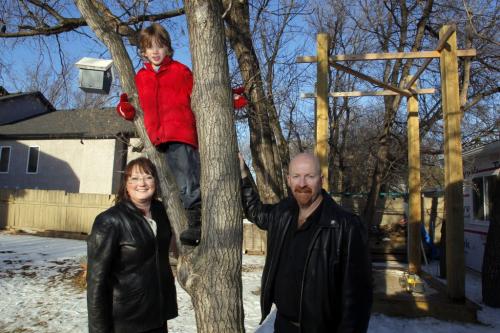 Eight-year-old Harley , in red, will get a tree house after all. Council's appeal committee overturned a previous decision to squash a plan for Harley's parents, Jules,r, and Laurel Freis,L, to build their son a 4.6-metre-high tree house in their Charleswood-area backyard. . January 5, 2012 BORIS MINKEVICH / WINNIPEG FREE PRESS