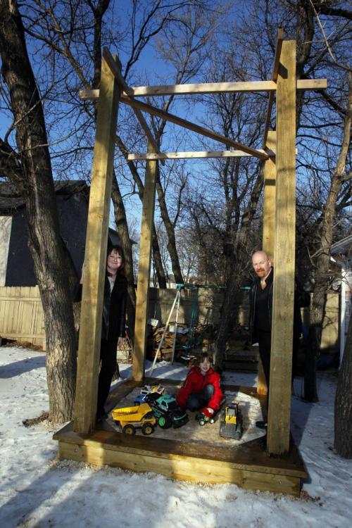 Eight-year-old Harley , in red, will get a tree house after all. Council's appeal committee overturned a previous decision to squash a plan for Harley's parents, Jules,r, and Laurel Freis,L, to build their son a 4.6-metre-high tree house in their Charleswood-area backyard. . January 5, 2012 BORIS MINKEVICH / WINNIPEG FREE PRESS
