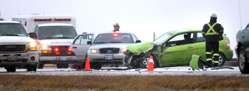 Perimeter highway traffic eases past an accident on the West side of the city just south of Wilkes Friday morning involving a car and truck. At least one person was transported to hospital. Jan 6, 2012 - (Phil Hossack / Winnipeg Free Press)