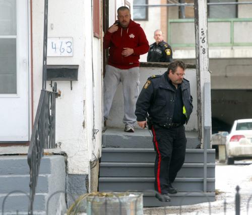 Police investigate a stabbing on spence street between ellice and sargent. Police go door to door asking if anyone knows anything. January 10, 2012 BORIS MINKEVICH / WINNIPEG FREE PRESS