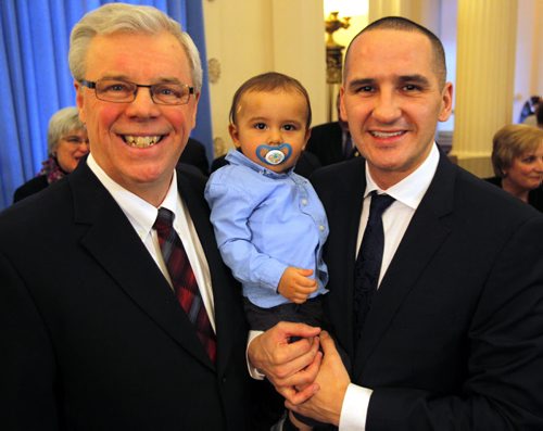 Manitoba Premier Greg Selinger with Manitoba newly appointed minister from Point Douglas MLA Kevin Chief, who becomes the minister of the new portfolio for children and youth opportunities. Chief is holding his kid  Hayden, 15 months.  January 13, 2012 BORIS MINKEVICH / WINNIPEG FREE PRESS