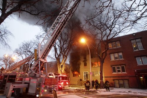 A fire has completely engulfed the apartment block at 577 Sherbrook leaving dozens of people homeless. The fire started around 6am according to witnesses on the scene. By 8am the building was fully envovled.  120114 - Saturday, January 14, 2012 -  (MIKE DEAL / WINNIPEG FREE PRESS)