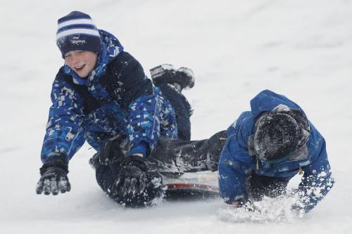 January 15, 2012 - 120115  - Connor Powell (12) and his brother Evan (6) wipe out while sledding at Assiniboine Park Sunday January 15, 2012.    John Woods / Winnipeg Free Press