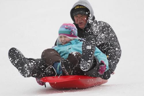 January 15, 2012 - 120115  -  John Spoelstra, who was in from Niagara visiting his eight year grand-daughter Katrina Strempler, goes sledding at Assiniboine Park Sunday January 15, 2012.    John Woods / Winnipeg Free Press