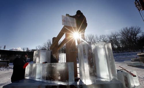 A ice sculpture and warm up hut created by architech Frank Gehry starts to take form by workers at The Forks Tuesday. Stanup picture. Jan 17, 2012 (Ruth Bonneville /  Winnipeg Free Press)